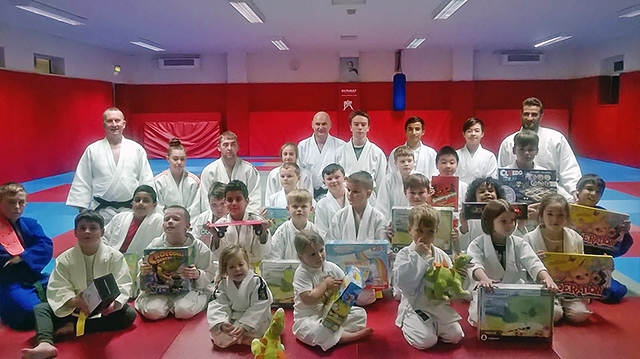 Rochdale Judo Club children with gifts from Swansway Honda