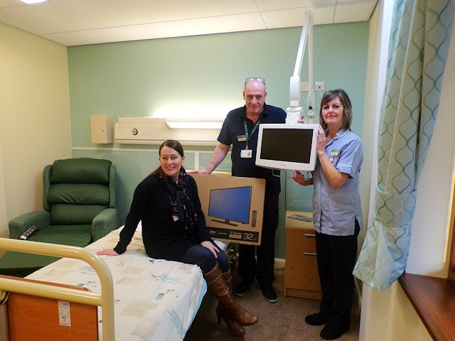 Lisa Greenhalgh, Mick Downes and Hilda Wild with the new flat screen televisions