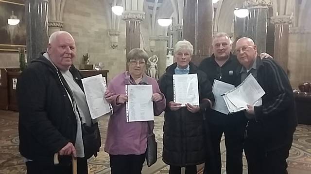 The New Rochdale Pioneers prepare to hand over their petition of 1,200 signatures