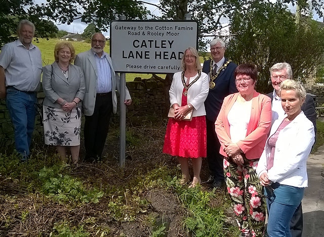 Alan Rawsterne, Cecile and Surinder Biant, The Mayor and Mayoress, Ian and Christine Duckworth, Janet Emsley, Tony Lloyd MP and Sue Devaney at the new Catley Lane Head sign