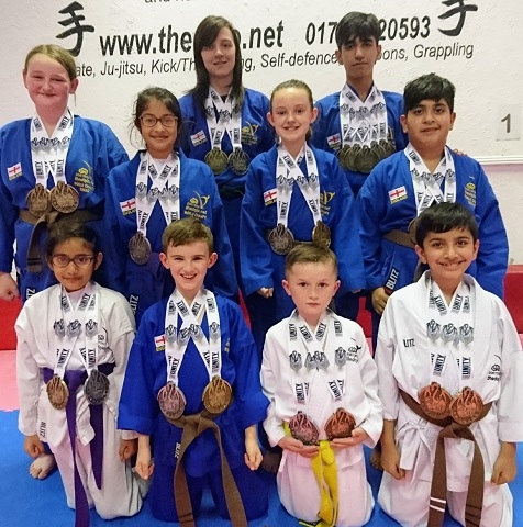 Dojo members with their world medals