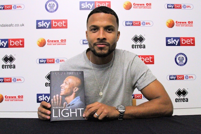 Joe Thompson with his autobiography, 'Darkness and Light: My Story'