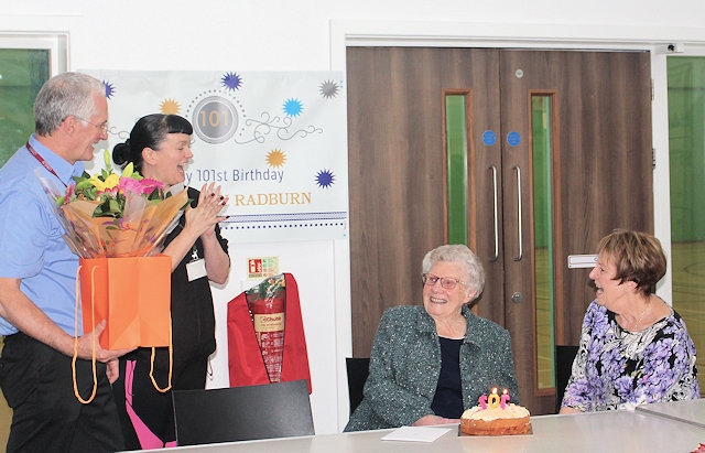 Gladys Radburn being presented with her presents and cake