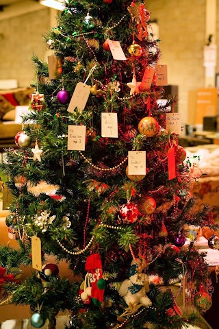 Christmas tree with the names, and ages, of children who are unlikely to receive a Christmas gift this year