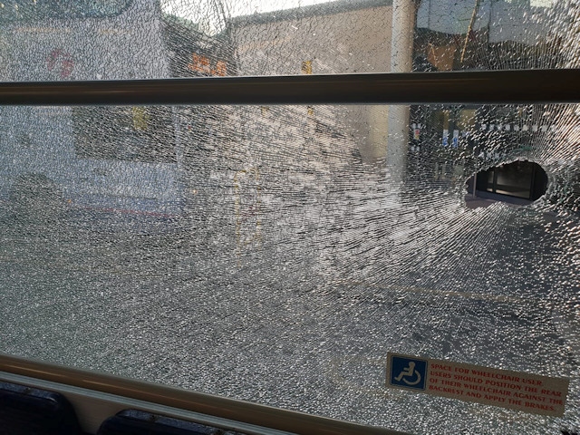 Youths smashed a bus window