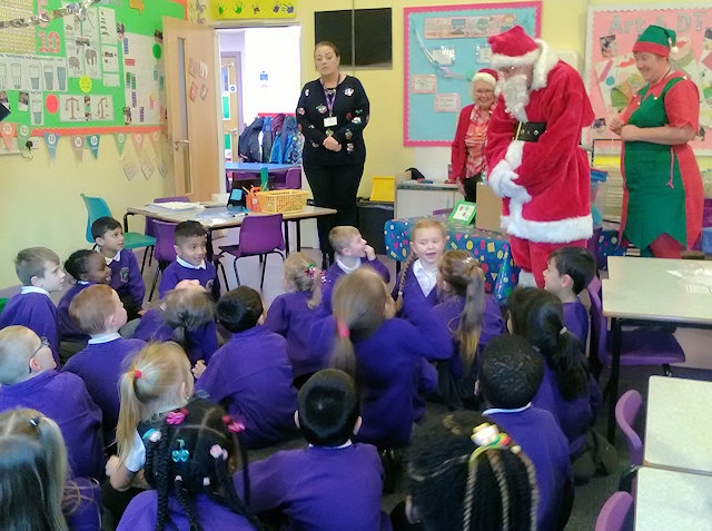 Santa and his elves visit children at Sandbrook Primary