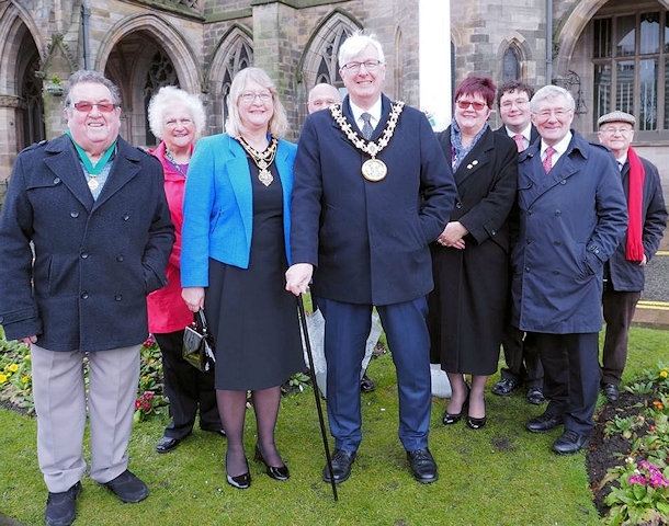 Mayor and Mayoress, Ian and Christine Duckworth, at the flag raising with MP Tony Lloyd and local councillors