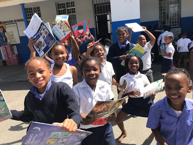 Children with the English language books donated as part of the ‘Help a South African School’ scheme