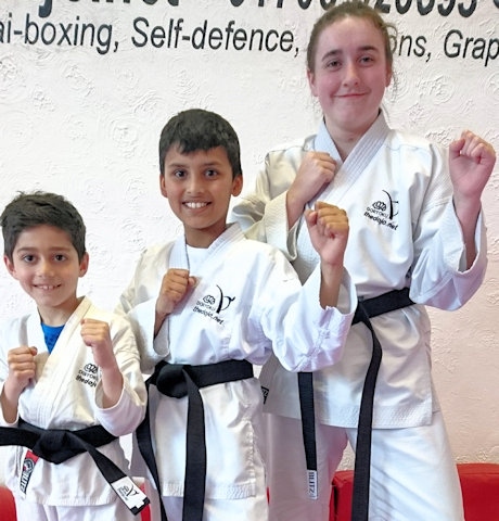 Mohammad Ali,  Aditya Roy and Abigail White from the DOJO Karate Centre with their Black Belts