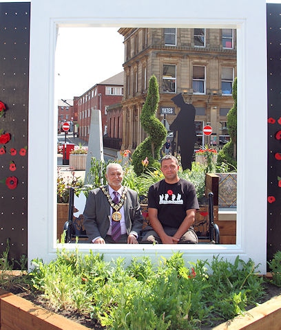 Mayor Mohammed Zaman opens the World War One pop up garden in Rochdale town centre with Paul Ellison 
