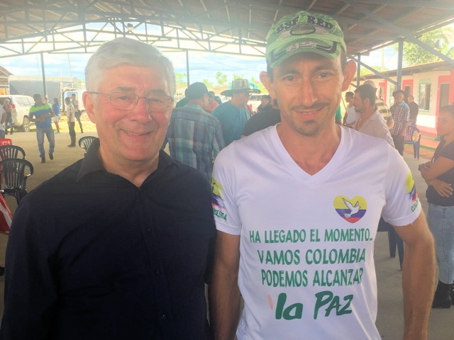 MP Tony Lloyd with a man whose t-shirt pledges a commitment ti fight for peace
