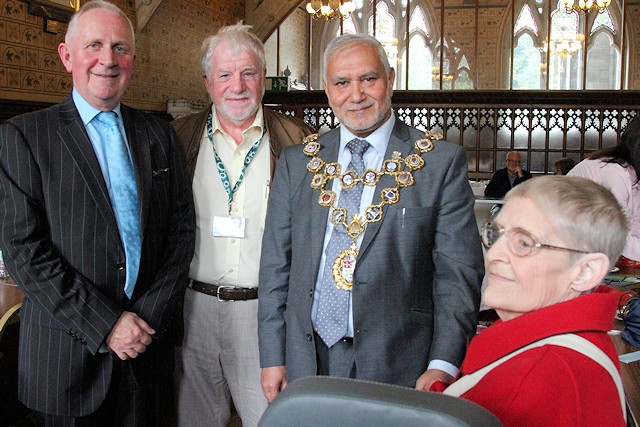 Councillor Ashley Dearnley, Mayor Mohammed Zaman, Leader of the Council Allen Brett and one of Shopmobility's longest members, Pauline Holt