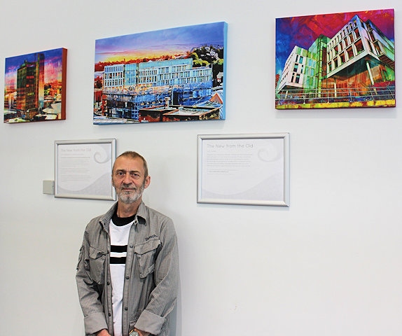 Artist John Cooke with his work which is now on display at Rochdale Central Library