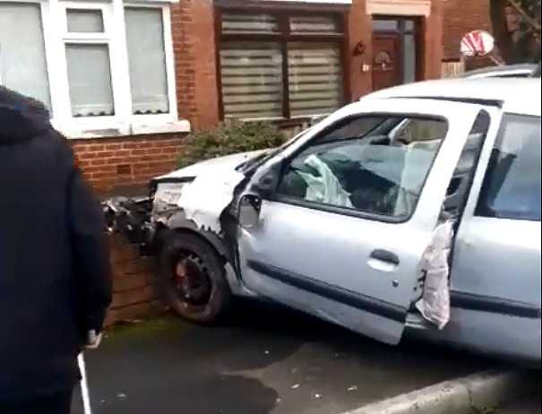 The car, suspected stolen, collided with a wall