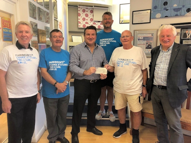 Mike Goldrick (centre) presents a cheque to Ken Horan (second right), joined by Paul Mullen (back) and Rotarians Peter Gilmartin, Toni Fletcher (left) and Edwin Partridge (far right)