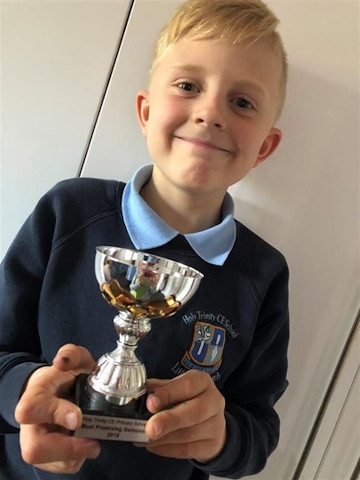 Zachariah Morris with his school swim trophy