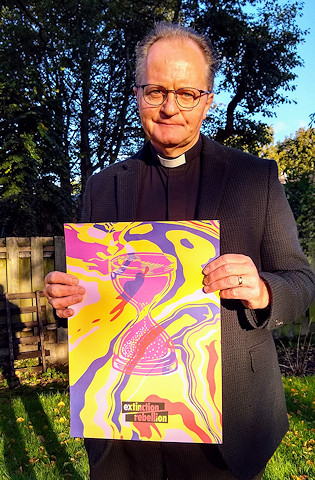 Close-up of Revd. Mark Coleman with his poster