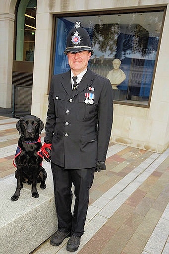 Damian on parade at the Lord Mayor's Parade with assistance dog Gibson, representing Hounds for Heroes