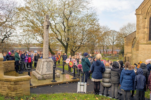 Pupils from Milnrow Parish CE Primary School at the war memorial
