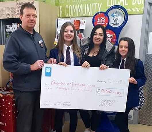 Whitworth Co-op support the town youth club (L-R: manager Mark Bottomley, Paris Warburton, Youth Leader Sarah Corke and Mia Tighe