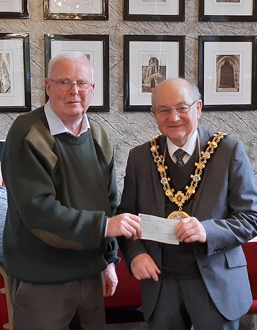 Mayor Billy Sheerin presented a cheque to the Veterans Breakfast Club, received by Wing Commander David Forbes
