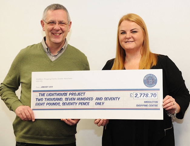 Carl Roach, The Lighthouse Project is presented with a cheque for £2,778.80 by Anna Ramsden 