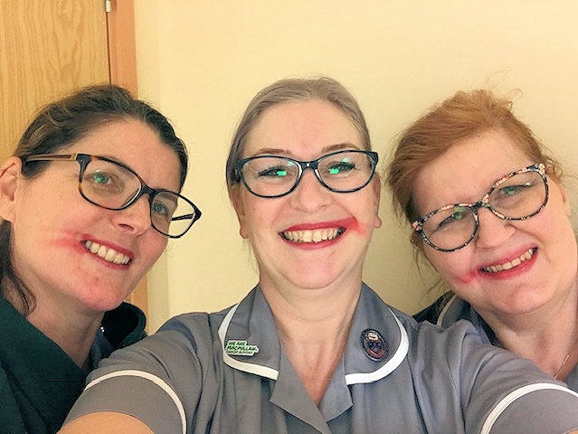 Amanda Storey, gynaecology Macmillan nurse with colleagues Tracey Dixon and Julie Dale. All the ladies have smeared their lipstick
