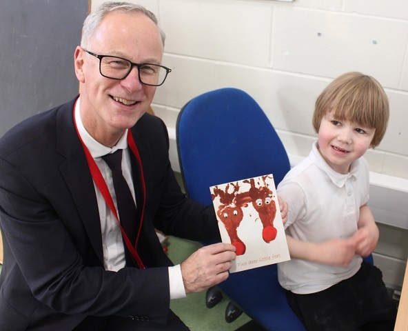 Chief executive Steve Rumbelow meets Dylan Law at Springside Primary School, came up with Rudolf inspired reindeers