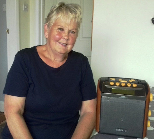 Visually impaired recipient with one of the charity's radios