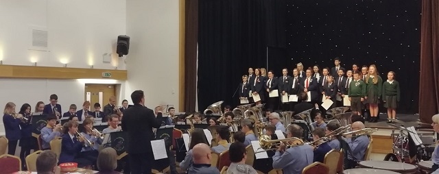 Whitworth Community High School band and choir and 2nd Rossendale Scout Group band entertain at The Riverside in Whitworth