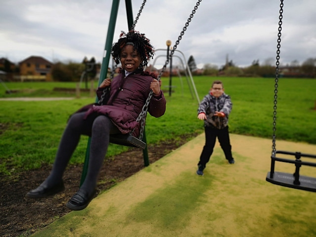 Child from Meanwood Primary School swinging 