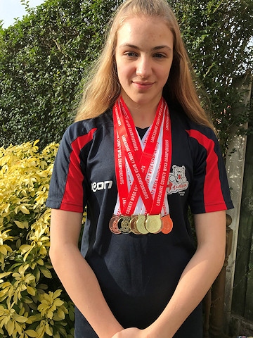 Lucy Cannavan with her medals