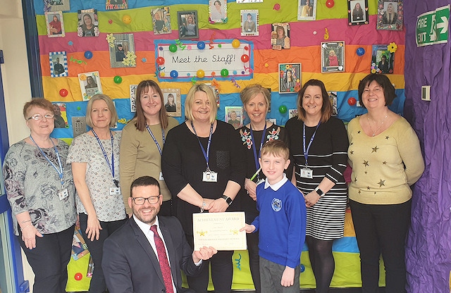 Ethan Rothwell with Headteacher Chris Crook (front), and Mrs Clegg, Mrs Ford, Mrs Booth, Miss Irvine, Mrs Howells, Mrs Harding, Mrs Taylor (back L-R)