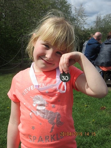 Ella Lockwood with her Hospice to Hospice medal