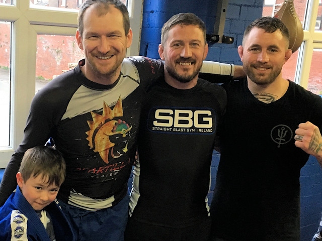 John Kavanagh (centre) with Bellator fighter Martin Stapleton (right) and Glyn Powditch and Ted Powditch 6 (left)