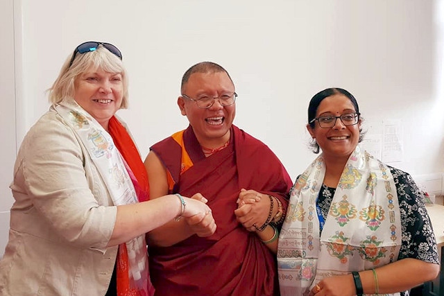 Buddhist monk Ahbay Rinpoche with staff at Castleton Primary School