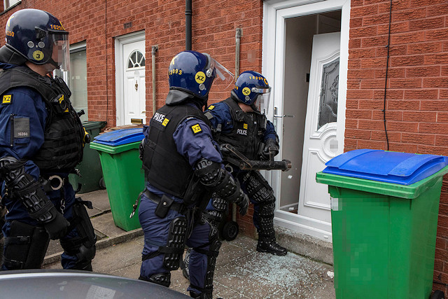 Operation Gallant - police break down a door