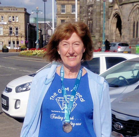 Wendy Mills, Gem Appeal Fundraiser and Trustee, following her Great Manchester Run to raise money for the GEM Appeal