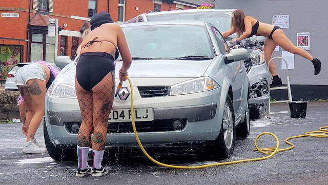 The girls washing cars