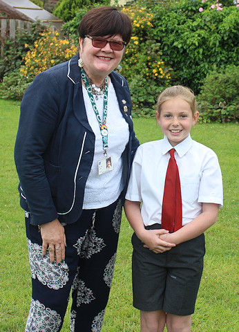 •	Councillor Janet Emsley, cabinet member for culture, with competition winner Rose Bonnar, a pupil at St Peter's RC Primary School in Middleton