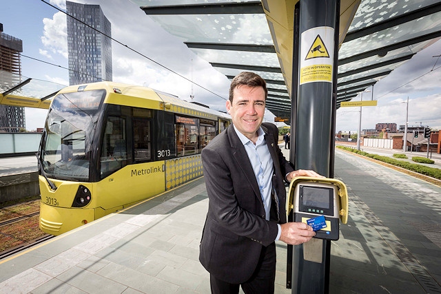 Greater Manchester Mayor Andy Burnham touches in on the new contactless system