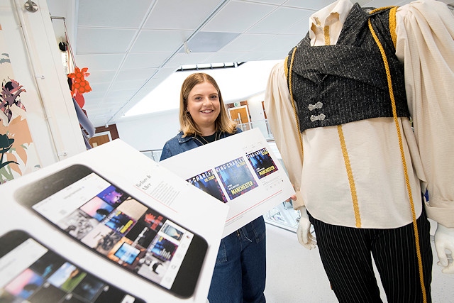 Louise Barlow with her portfolio and the outfit that fellow student Beatriz designed