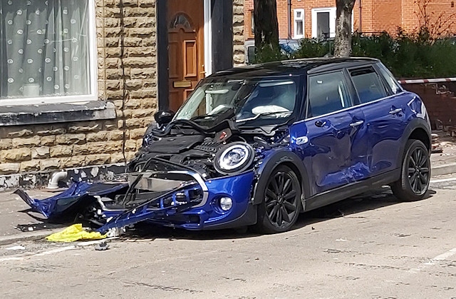 A blue Mini Cooper has been involved in a collision on Entwisle Road