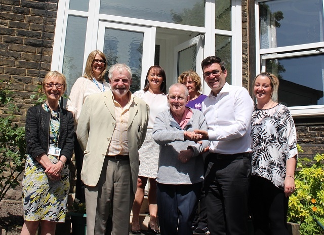 Councillor Allen Brett, leader of Rochdale Borough Council, and Andy Burnham, Mayor of Greater Manchester, with council staff, and staff and residents of Rosemary Care Home