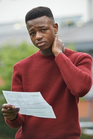 Boy worried about exam results (posed by model)