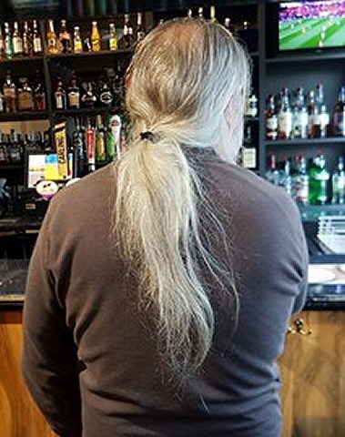 Geoff Street and his prized ponytail before the big chop