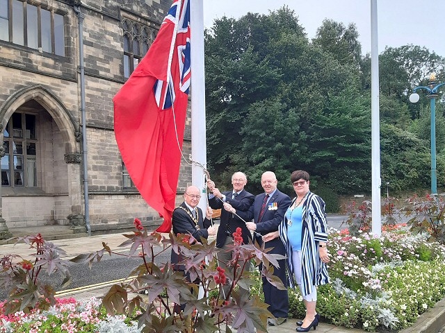 Mayor Billy Sheerin hoisted flags for Merchant Navy Day