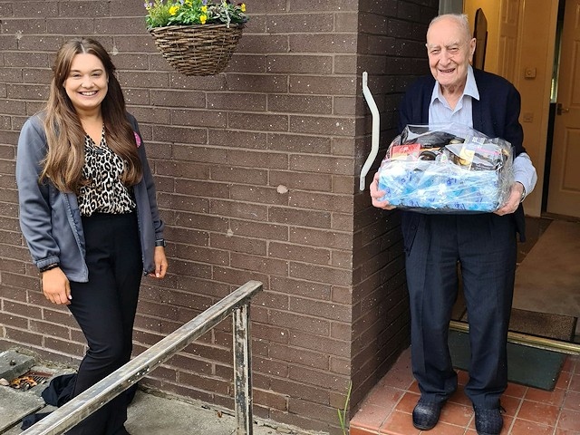 Harold Burgess with a hamper donated by Norden Co-Op