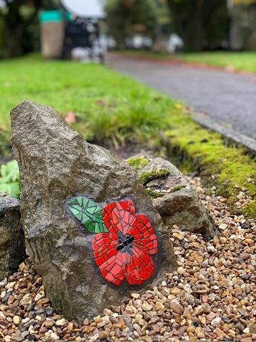 The mosaic poppy stone at Norden War Memorial
