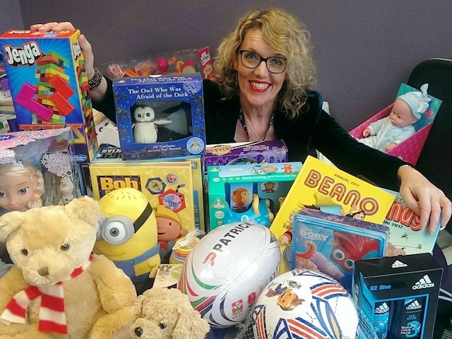Giving Back Charity Member Helen Walton with gifts donated last year